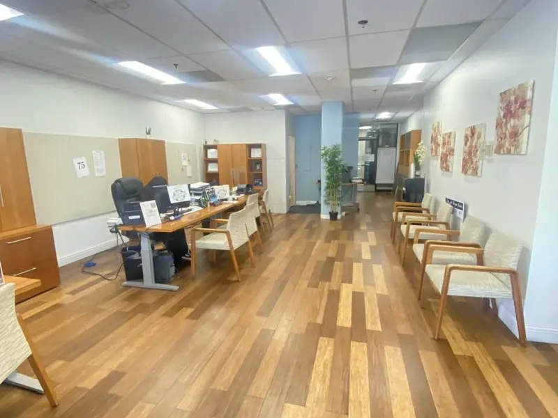 Inside the San Jose office at 25 N. 14th Street, Suite 125 — agent desks on the left, customer seating on the right