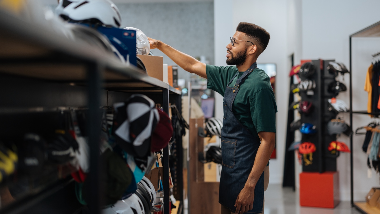 Young business owner working in store