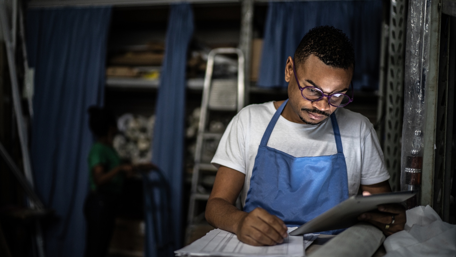 Male business owner doing paperwork.
